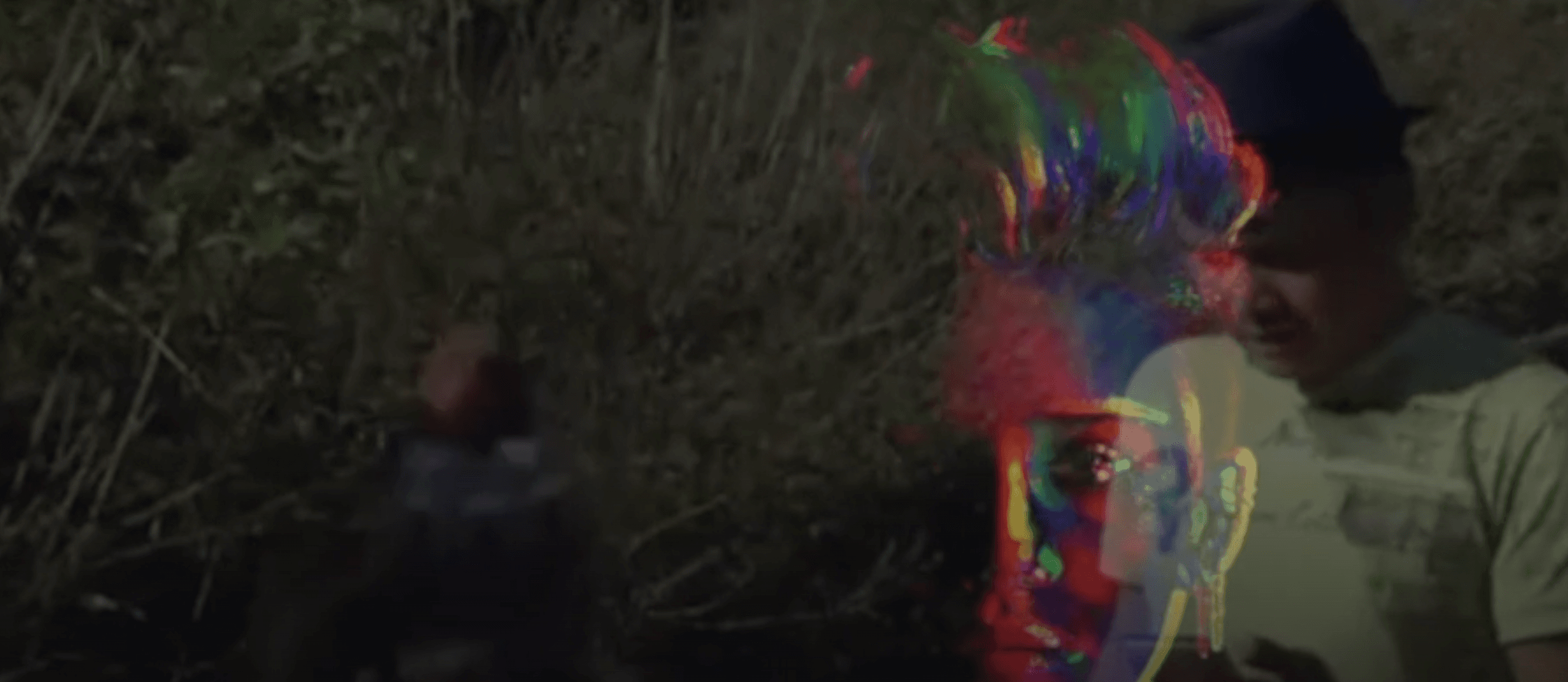 Distorted overlay of pop spectacle and refugee crisis