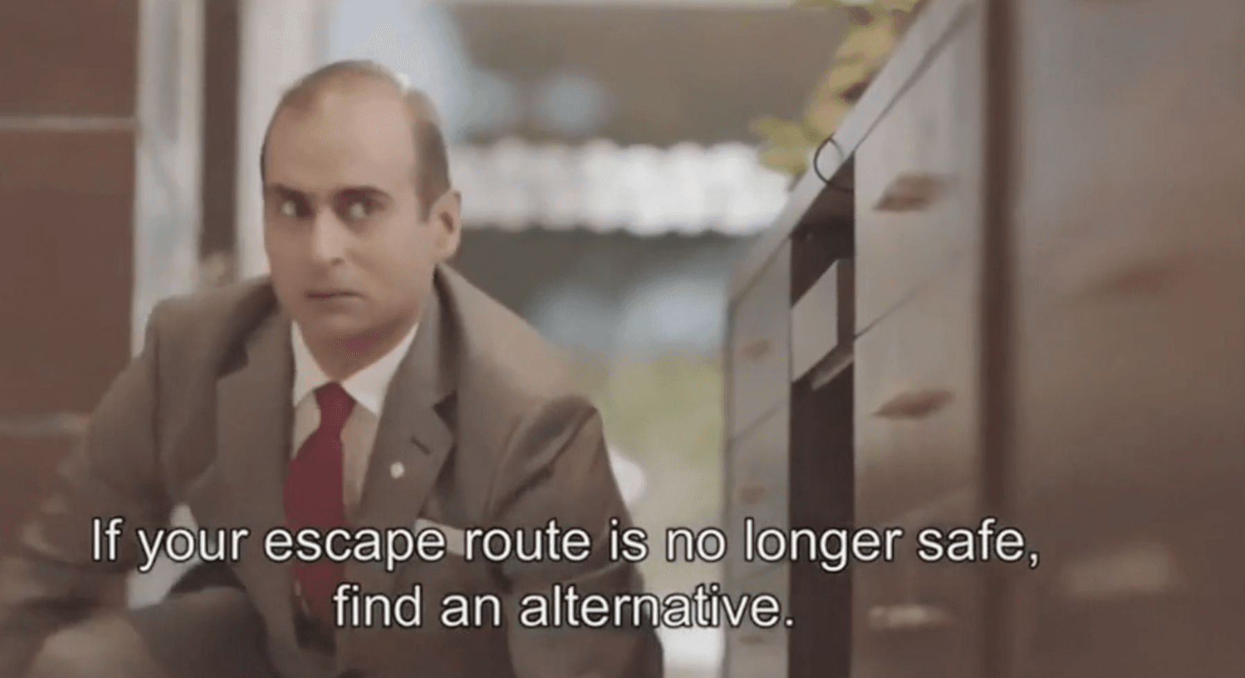 Figure in suit with subtitle 'If your escape route is no longer safe, find an alternative'