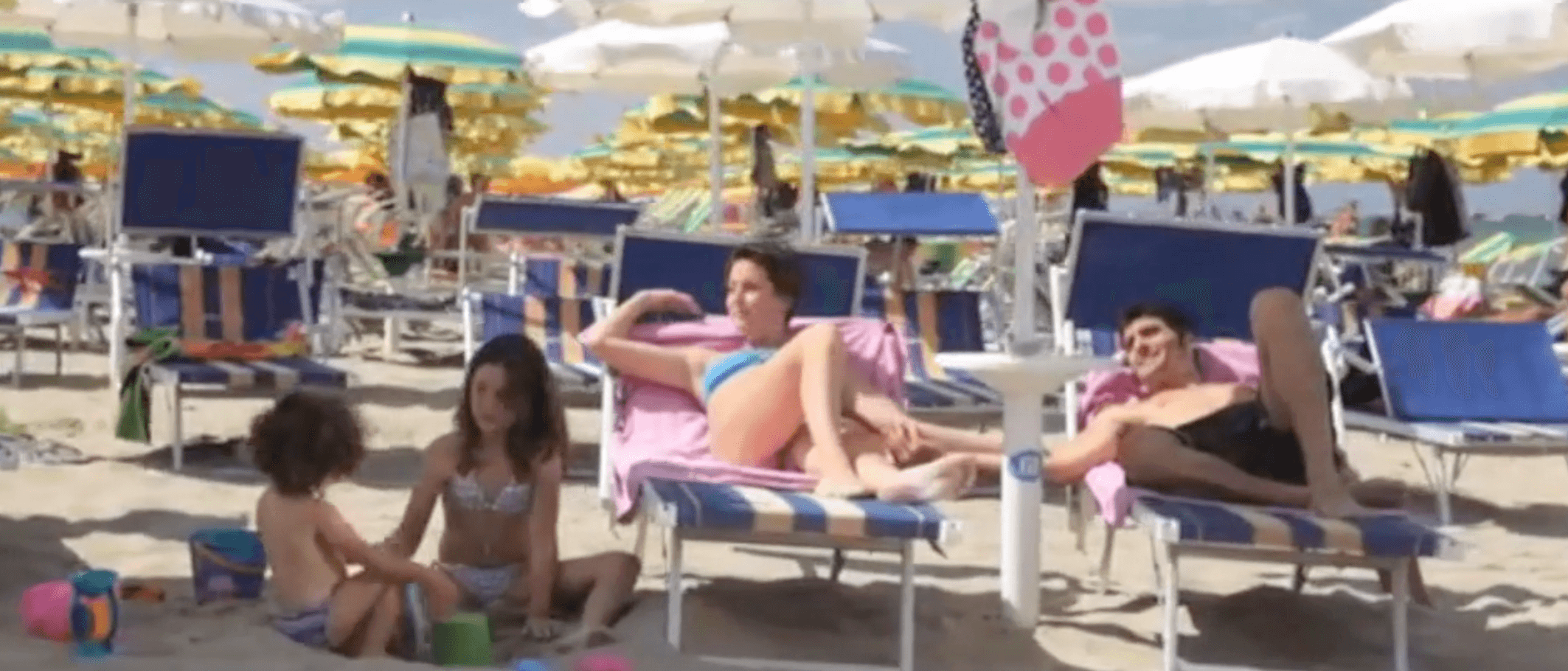 Tourists at beach resort - leisure scene before collapse