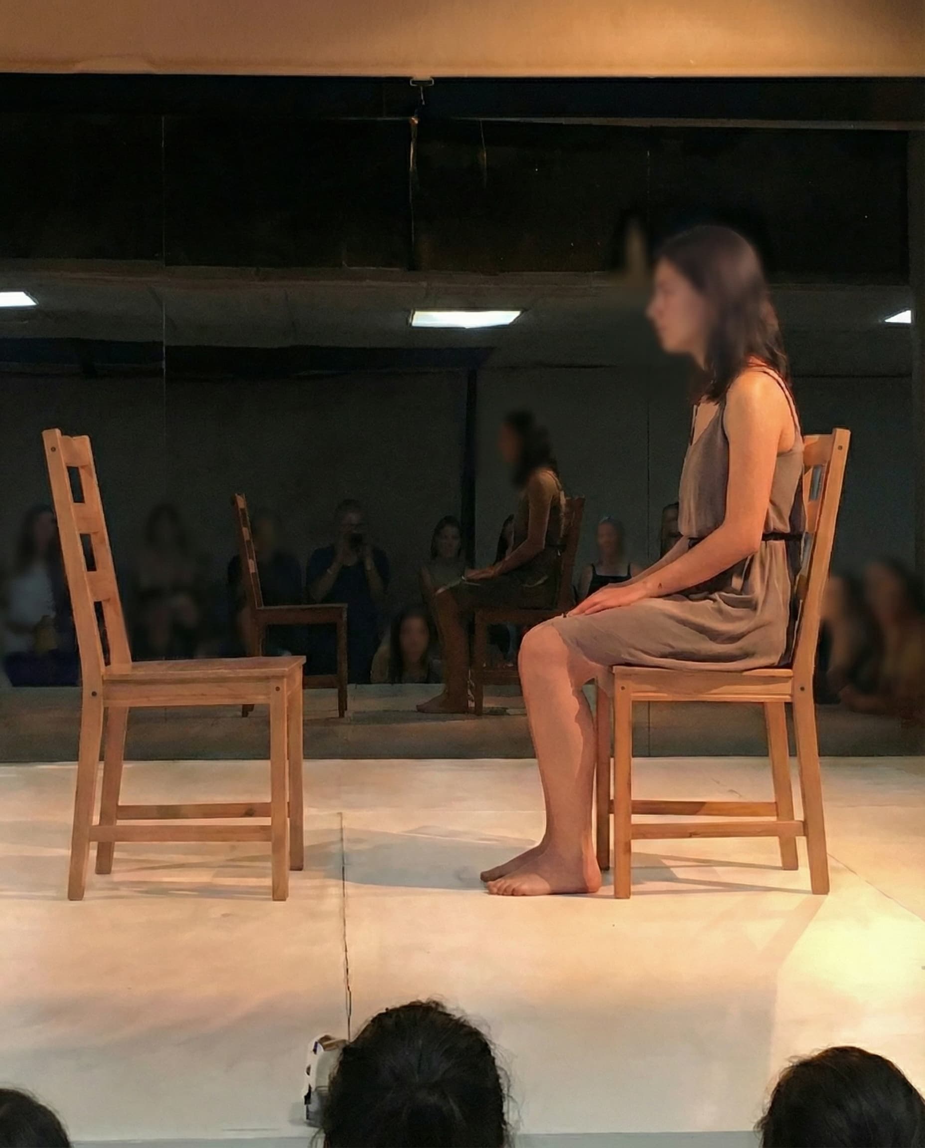 Woman from audience seated during Manifesta '16 performance